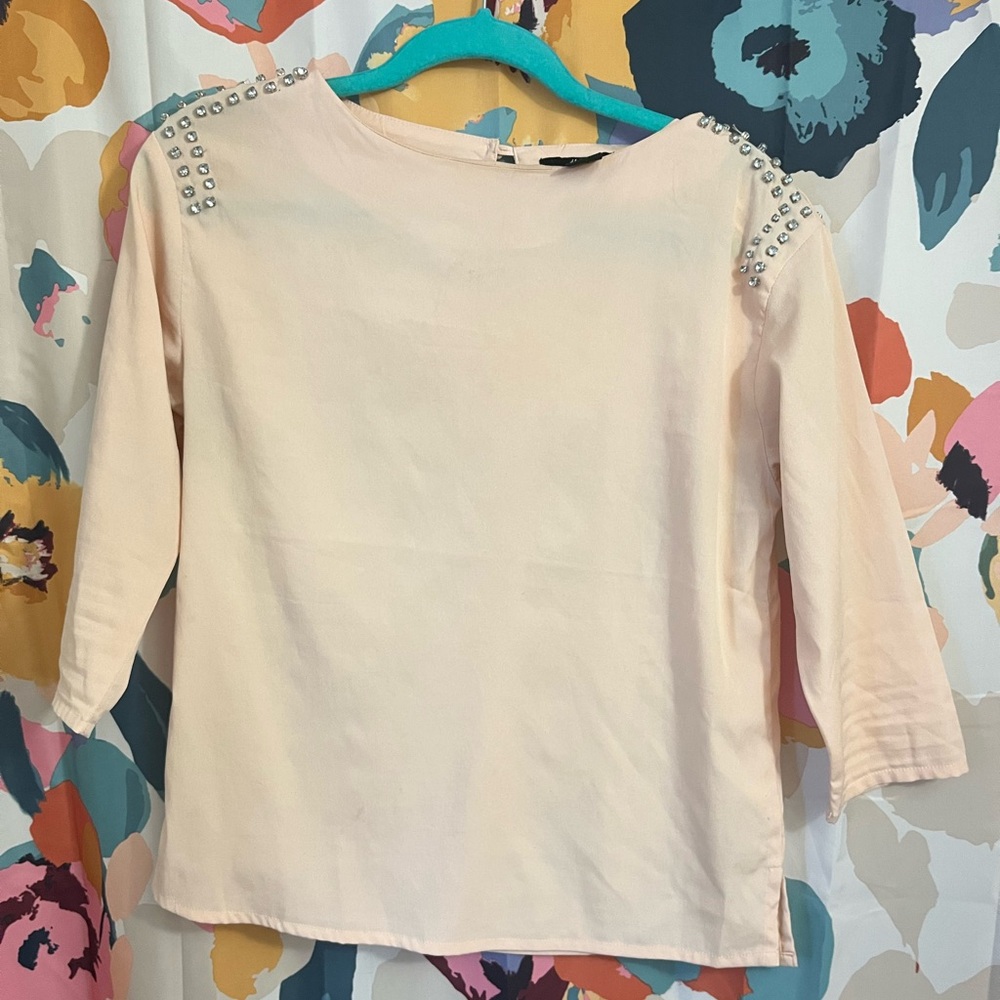 Peach blouse with shoulder detail